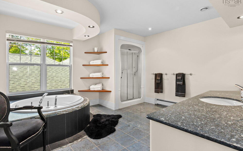 Bathroom with vanity, a garden tub, a stall shower, tile patterned flooring, and recessed lighting