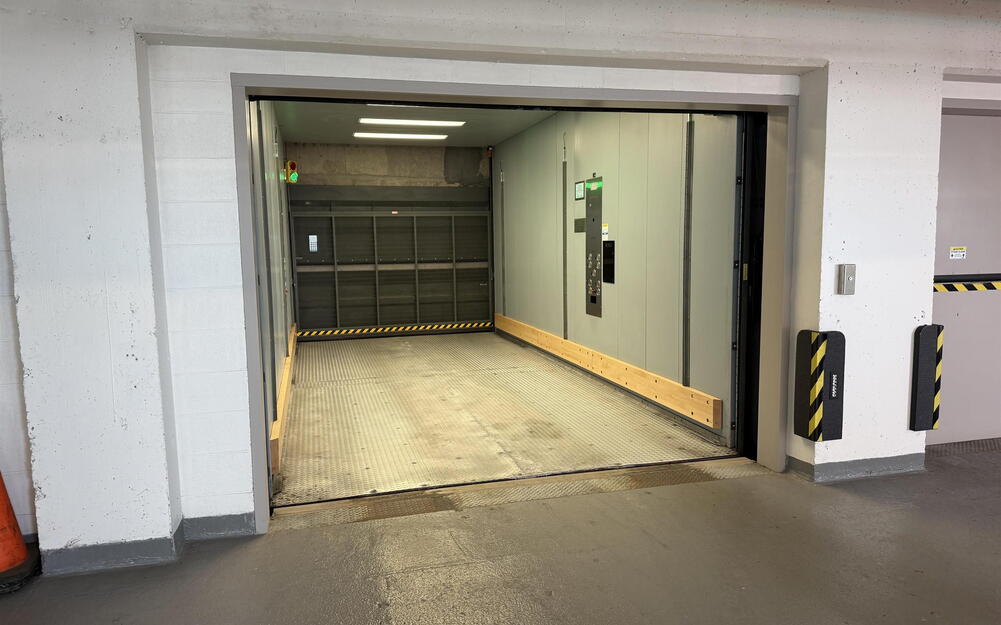 Loading dock featuring a wide entry, corrugated metal floor, and integrated control panel